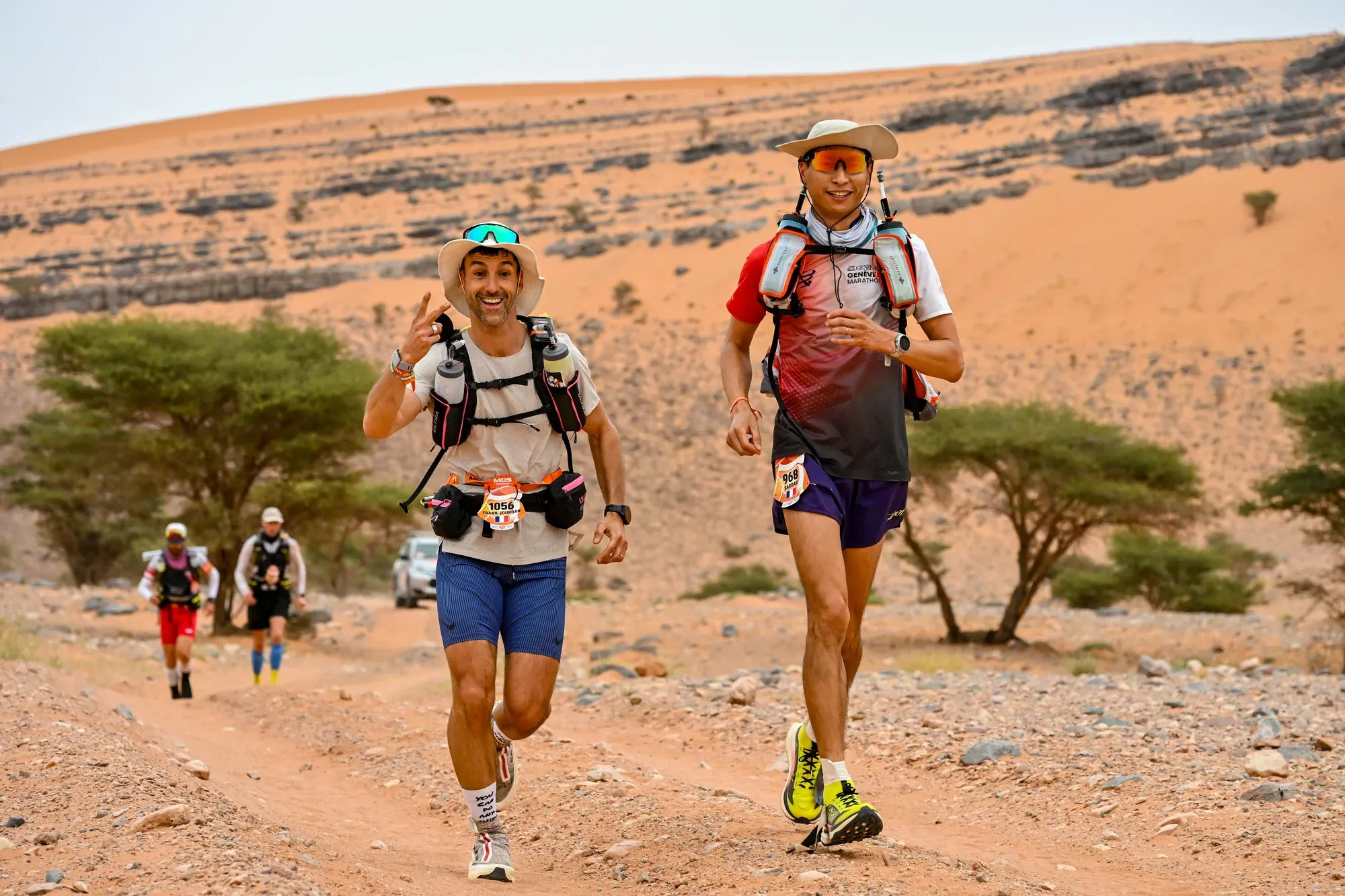Sardar Azimov running with orange sand dunes at MDS 2026