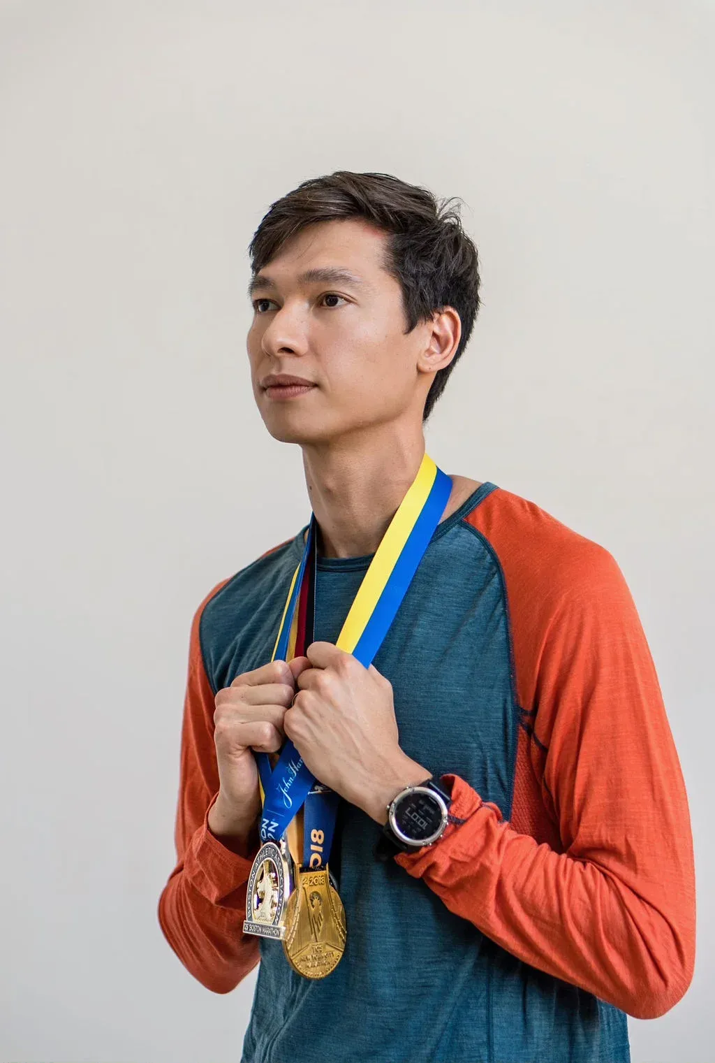 Sardar Azimov with marathon medals after Boston 2021